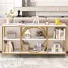 A console table with decorative items and books on it, placed in a living room setting. Náhľad obrázku produktu