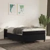 A bedroom scene with a bed, artwork, and a plant. Voir les images du produit