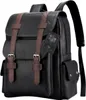 A black rucksack with brown straps and buckles, shown from the front. Produktbild-Vorschau