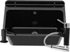 A black kitchen sink with a faucet and soap dispenser. Náhled obrázku produktu