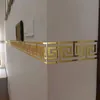 A corner of a room with a decorative gold border applied to the wall. Náhľad obrázku produktu