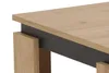 Close-up view of a modern coffee table's corner, showing the wood grain texture and a dark gray accent. Produktbild-Vorschau
