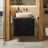 A modern bathroom vanity with a vessel sink and wooden accents. Anteprima dell’immagine prodotto