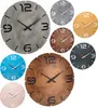A collage of various wall clocks with different colored faces and designs. Produktbild-Vorschau
