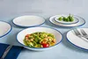 A table setting with plates and food. Voir les images du produit