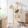 A multi-level cat tree with three cats interacting with it, placed in a living room setting.