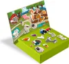 A magnetic farm-themed playset with various animal and farm-related magnets on a green box and a backdrop depicting a farm scene. Podgląd zdjęcia produktu