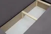Close-up view of the internal structure of a sofa, showing wooden supports and the fabric lining. Voir les images du produit
