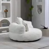 A beige bean bag chair with cushions in a modern living room setting. Produktbild-Vorschau