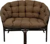 A brown rattan sofa with cushions, shown from the front on a white background. Produktbild-Vorschau