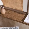 A close-up view of a wooden shelf with decorative items. Podgląd zdjęcia produktu