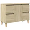 A light brown wooden cabinet with four doors and four legs, shown from the front. Náhled obrázku produktu