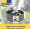 A close-up of a blender blade assembly with a caution symbol, set against a blurred background of a smoothie and kitchen appliances. Produktbild-Vorschau