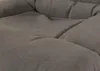 A close-up view of a dark gray, tufted fabric surface, likely a cushion or part of a piece of furniture. Produktbild-Vorschau