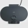 A top-down view of a black waffle maker with a temperature dial and a green indicator light. Produktbild-Vorschau