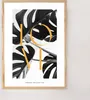 A framed poster with a black and white image of monstera leaves and the word "LOVE" in large yellow letters. Produktbild-Vorschau