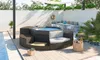 An outdoor patio area with a hot tub and seating. Produktbild-Vorschau