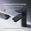 A black faucet is shown next to a smartphone on a sink. Produktbild-Vorschau