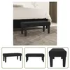 A black velvet bench is placed in front of a bed in a bedroom setting. Podgląd zdjęcia produktu