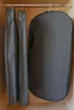 Three garment bags hanging on a closet rod. Produktbild-Vorschau