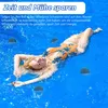 A woman is floating in a pool with several filter balls around her. Produktbild-Vorschau