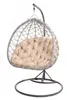A hanging egg chair with a beige cushion, shown in a studio setting against a white background. Produktbild-Vorschau