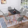 A dining set with a black table and six gray chairs in a room with a window. Voir les images du produit