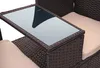 Close-up of a brown poly-rattan bench with a glass tabletop and a beige cushion. Náhled obrázku produktu