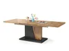 A dining table with a wooden top and a black and wood pedestal base, set against a white background. Produktbild-Vorschau