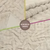 A close-up of a textured, cream-colored blanket with overlay text. Produktbild-Vorschau