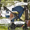 A stroller with its attachments in an outdoor setting. Produktbild-Vorschau