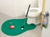 A toilet golf set is set up in a bathroom, next to a toilet. Produktbild-Vorschau