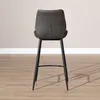A dark gray bar stool with black legs is shown from the back against a light gray wall and a wooden floor. Produktbild-Vorschau