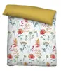 A flat lay of a duvet cover with a floral pattern and a solid yellow pillowcase. Produktbild-Vorschau