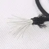 A close-up view of the frayed end of a black cord, revealing its white inner strands. Produktbild-Vorschau