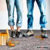 Two people in paint-splattered jeans and work boots stand on a drop cloth, with a paint can and brush nearby. Náhľad obrázku produktu