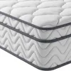 A close-up, side view of a white mattress with a gray trim. Produktbild-Vorschau