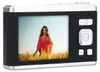 A woman is posing in a field of wheat, with a digital camera displaying her image. Náhľad obrázku produktu
