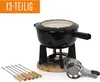 A black fondue set with accessories on a white background. Podgląd zdjęcia produktu