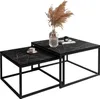 Two nesting coffee tables with a marble-like black and white pattern on a white background.