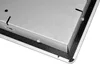 Close-up of the corner of a metallic device with a black textured surface underneath. Produktbild-Vorschau