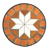 A round mosaic table top with a star pattern in the center, surrounded by orange tiles. Produktbild-Vorschau