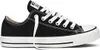 A single black Converse All Star low-top sneaker with white laces and a white sole, shown from the side against a white background. Voir les images du produit