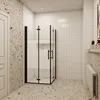 A modern bathroom with a glass shower enclosure, tiled walls, and terrazzo flooring. Produktbild-Vorschau