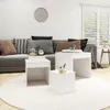 A living room scene with a sofa, coffee tables, and a rug. Náhled obrázku produktu