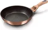 A single frying pan with a rose gold handle and speckled black interior is shown against a white background. Náhled obrázku produktu