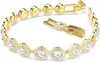 A gold-tone tennis bracelet with clear crystals, shown on a white background. Anteprima dell’immagine prodotto