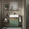 A modern bathroom with a green vanity, white sink, and a ladder shelf. Voir les images du produit