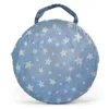 A blue play tunnel with white stars, folded and held by a handle. Produktbild-Vorschau