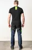 Back view of a man wearing a black t-shirt and work pants. Produktbild-Vorschau